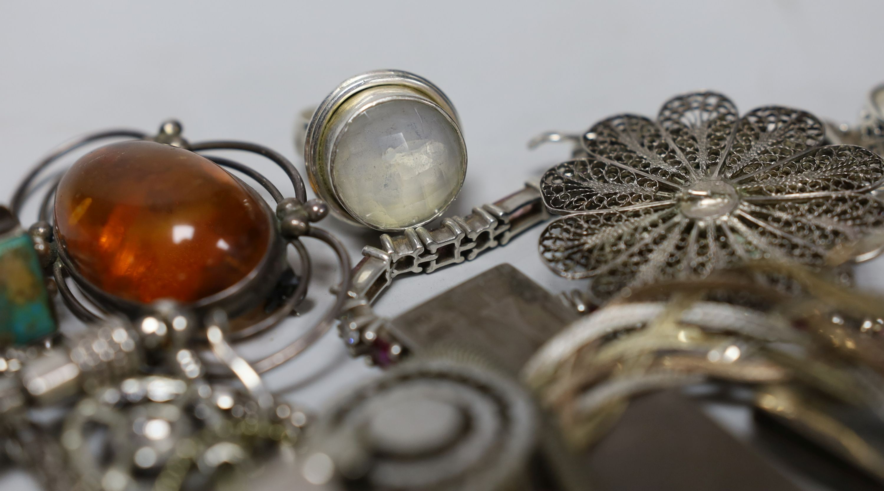 A quantity of assorted silver and white metal jewellery etc. including albert chain with pocket watch, bangles, bracelets, brooches, money clip and rings.